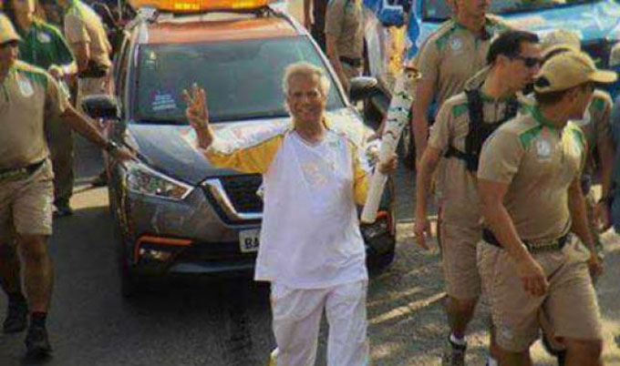 Dr.Yunus was carrying the Olympic torch