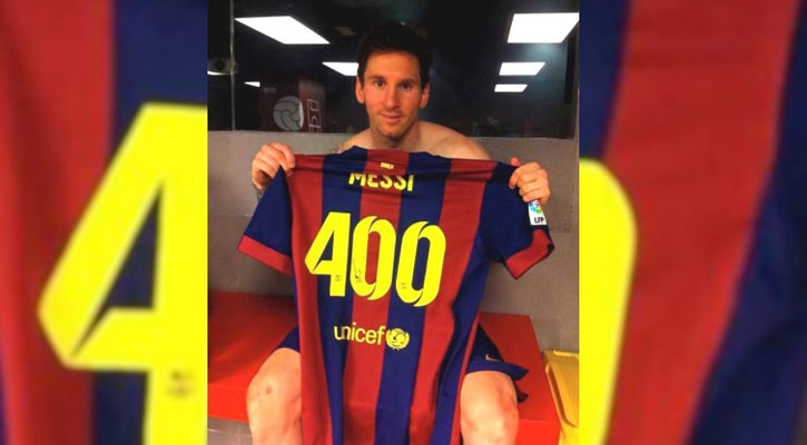 Messi standing in front of landmark