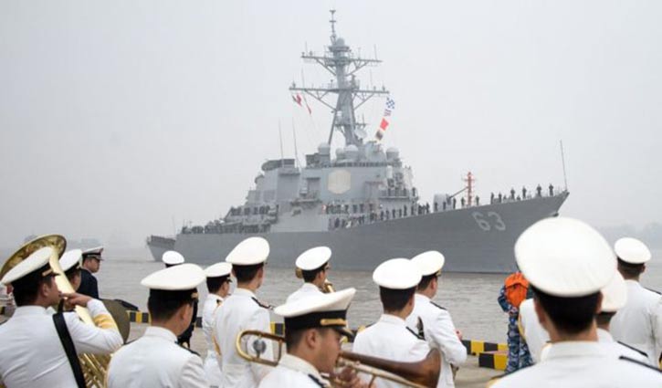 US warship near disputed island, angry China