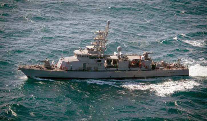 The Iranian ship is warned by US warships